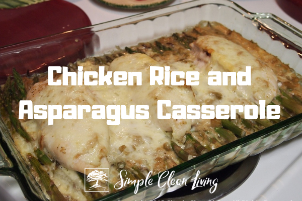 a baking dish with chicken rice and asparagus casserole