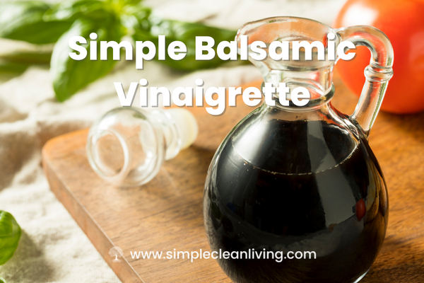 Simple Balsamic Vinaigrette Blog Post- A picture of a bottle of balsamic vinegar on a cutting board