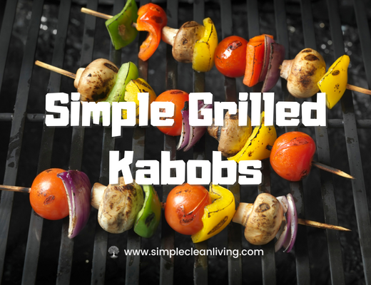 a grill holding several grilled kabob skewers covered in meat and vegetables