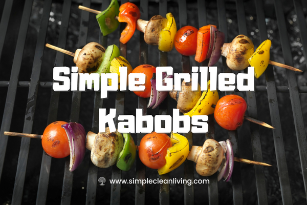 a grill holding several grilled kabob skewers covered in meat and vegetables