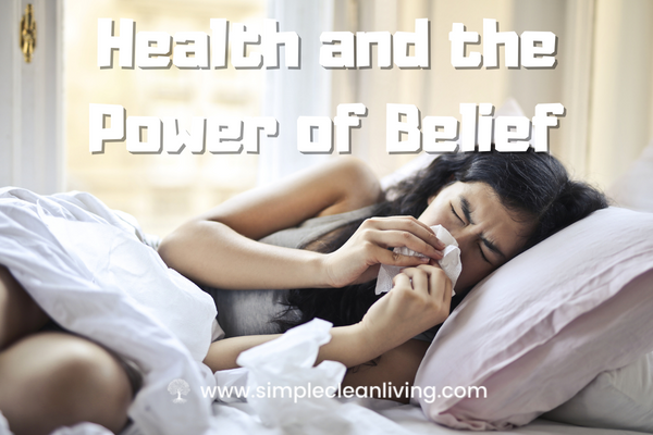 Health and the Power of Belief Blog Post- Picture of a woman laying in bed sick