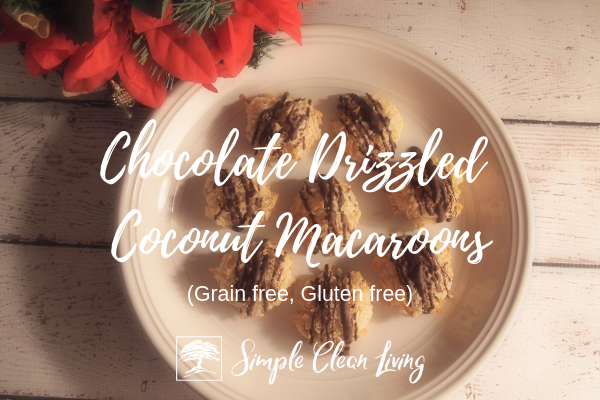 a white plate covered with chocolate drizzled coconut macaroons