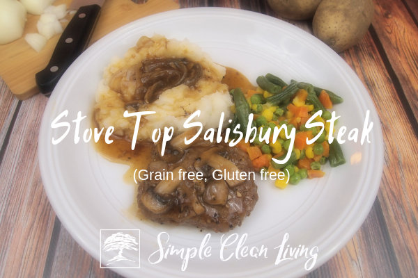 A plate with Salisbury steak with mashed potatoes and mixed vegetables