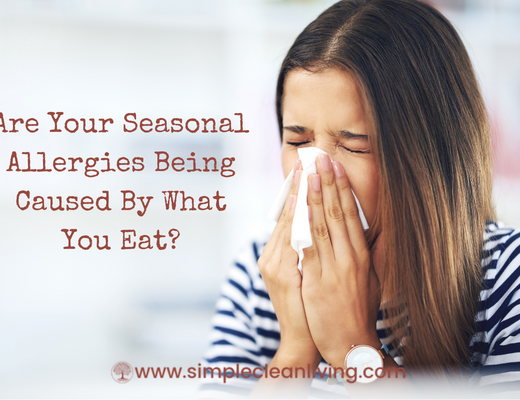 Are Your Seasonal Allergy Being Caused By What You Eat Blog Post- A woman blowing her nose into a tissue