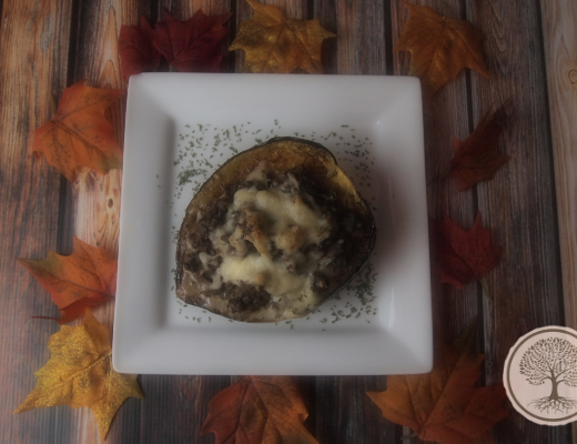 Picture of a white plate with a stuffed acorn squash on it and a recipe name overlay