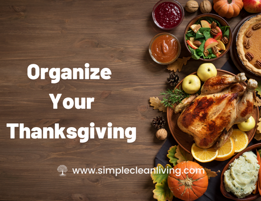 Organize Your Thanksgiving Blog Post with a picture of a table covered with traditional Thanksgiving foods