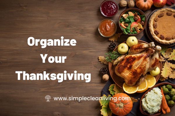 Organize Your Thanksgiving Blog Post with a picture of a table covered with traditional Thanksgiving foods