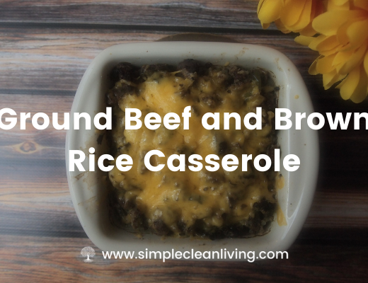 a baking dish with ground beef and brown rice casserole topped with cheese