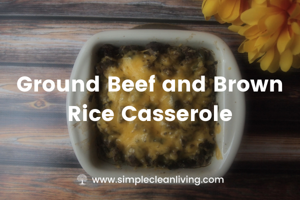 a baking dish with ground beef and brown rice casserole topped with cheese