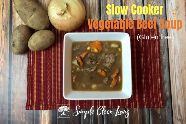 A picture of a bowl of soup with the blog post title "Slow Cooker Vegetable Beef Soup"