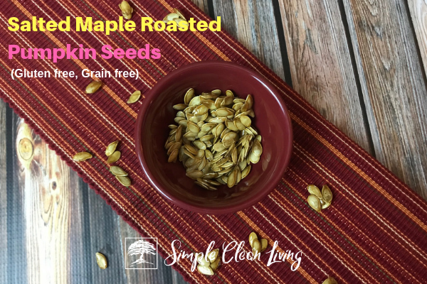 A picture of a bowl of roasted pumpkin seeds with the blog post title "Salted Maple Roasted Pumpkin Seeds, gluten free, grain free"