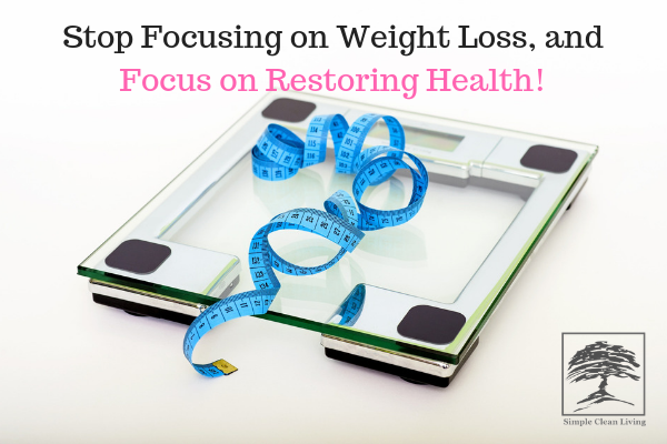 A picture of a scale with a measuring tape on it with the blog post title "Stop Focusing on Weight Loss, and Focus on Restoring Health"