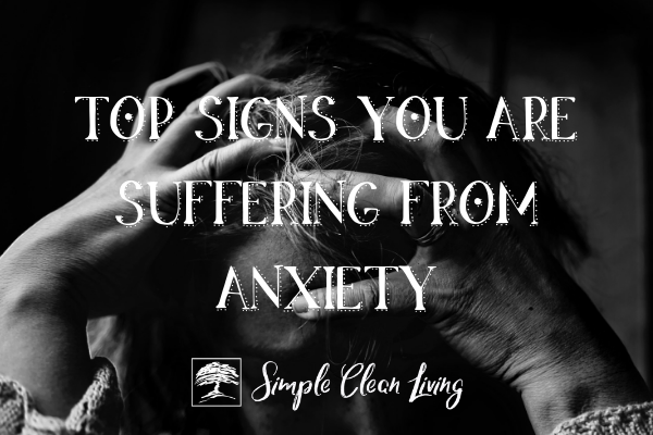 Picture of an anxious woman with the blog post title "Top Signs You Are Suffering from Anxiety"