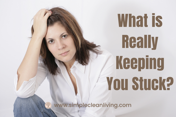 What is really keeping you stuck- picture of woman with frustrated look on her face