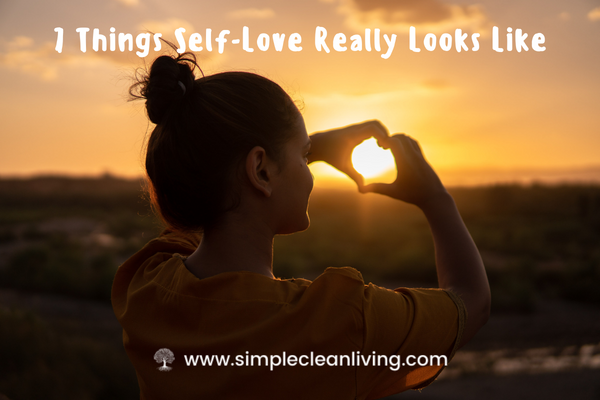 7 Things Self-Love Really Looks Like Blog Post- Picture of a holding up her hands in the shape of a heart