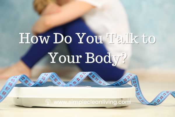 How to You Talk To Your Body Blog Post- Picture of a woman sitting with her head in her hands in a shameful position
