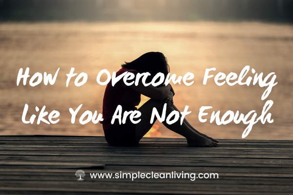 How to overcome feeling like you're not enough blog post- picture with a woman sitting curled up in shame