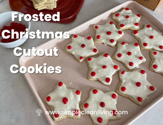 Frosted Christmas Cutout Cookies blog post with picture of a plate of festive cookies