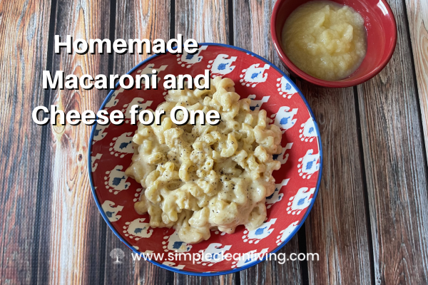 Homemade Macaroni and Cheese for One Recipe with picture of a red bowl filled with macaroni and cheese and a small red bowl filled with applesauce.