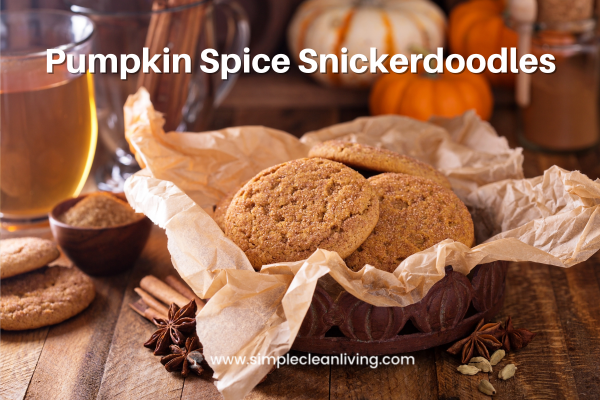 Pumpkin spice snickerdoodle recipe title with a picture of a basket of pumpkin spice snickerdoodles sitting on a talbe