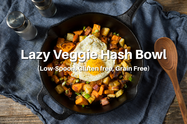 Lazy Veggie Hash Bowl recipe title with a picture of a cast iron skillet filled with the veggie hash topped with a fried egg.